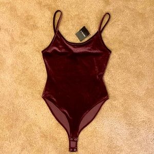 Brand new medium size bodysuit.